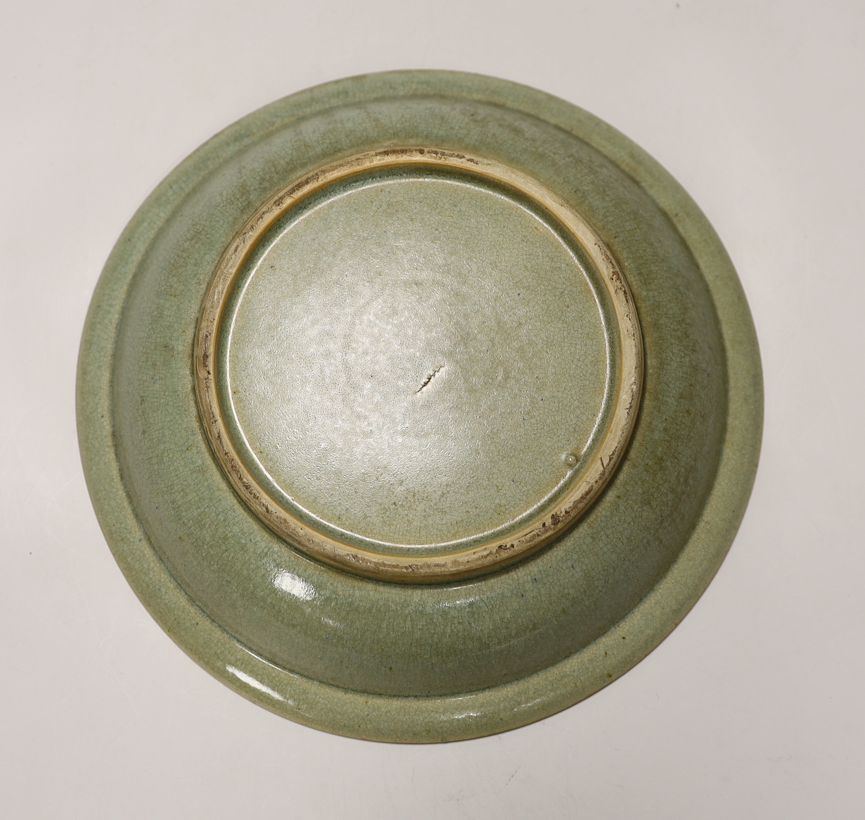 A Chinese celadon glazed 'twin fish' dish, 30cm diameter